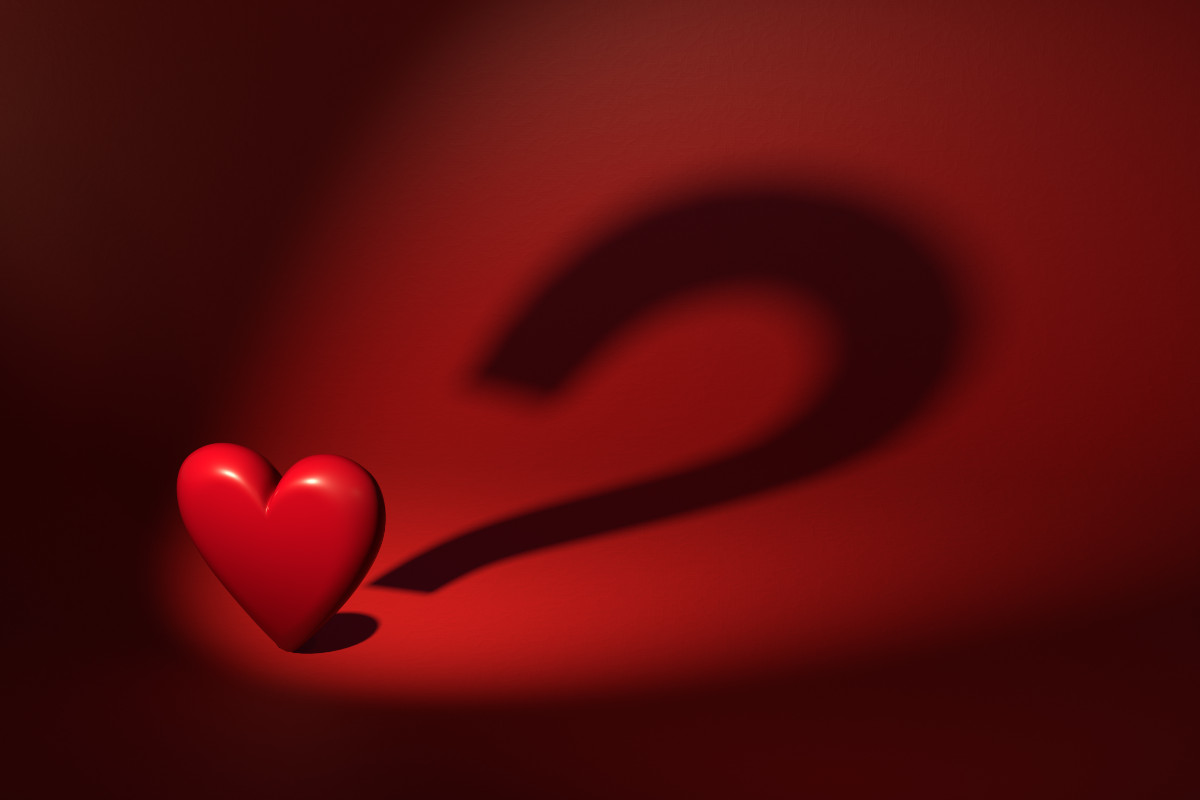An illustration of a heart in a spotlight, with its shadow forming a question mark.