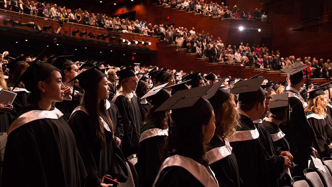Group of grads standing for graduation ceremony