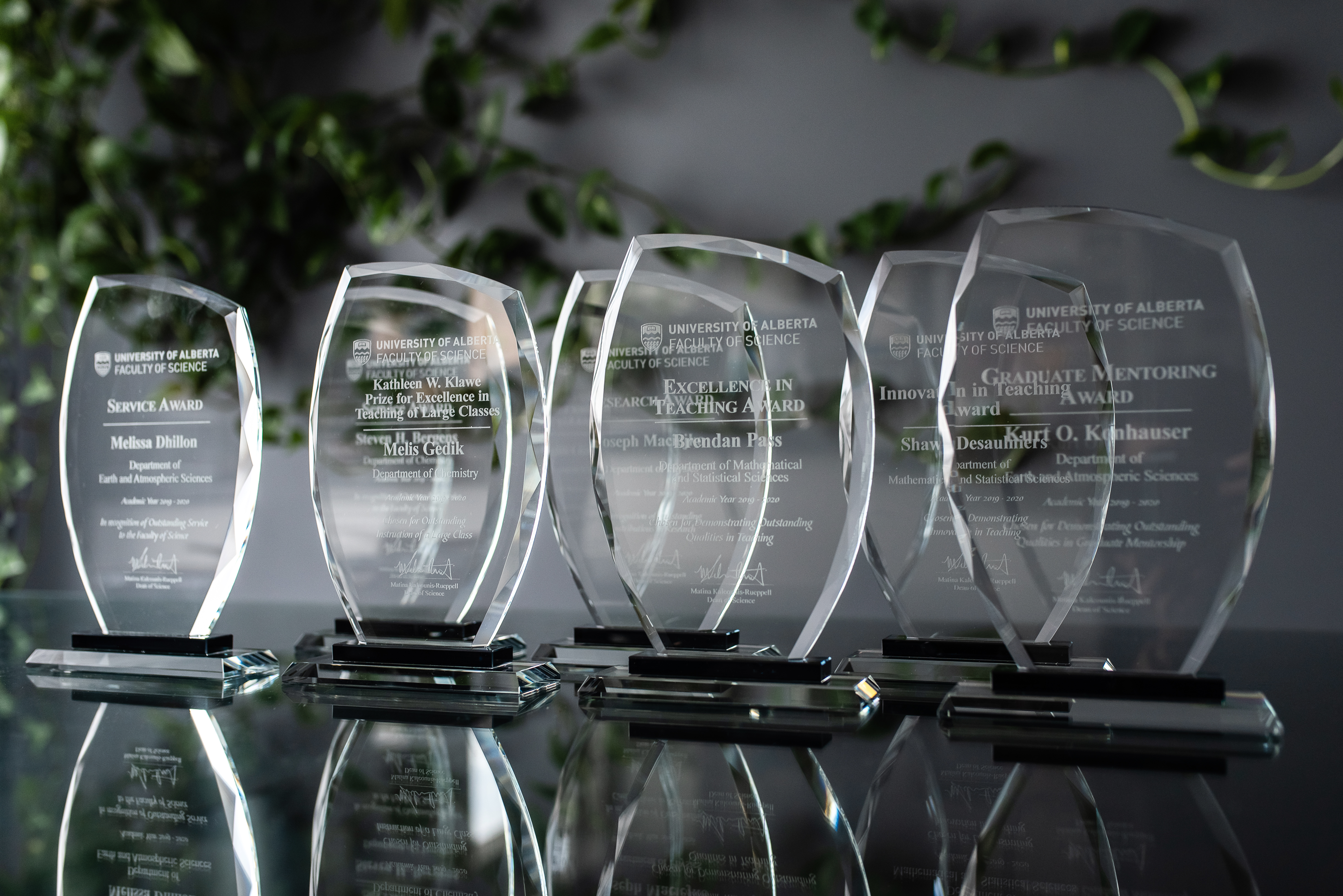 A selection of Celebration of Excellence awards on a table.