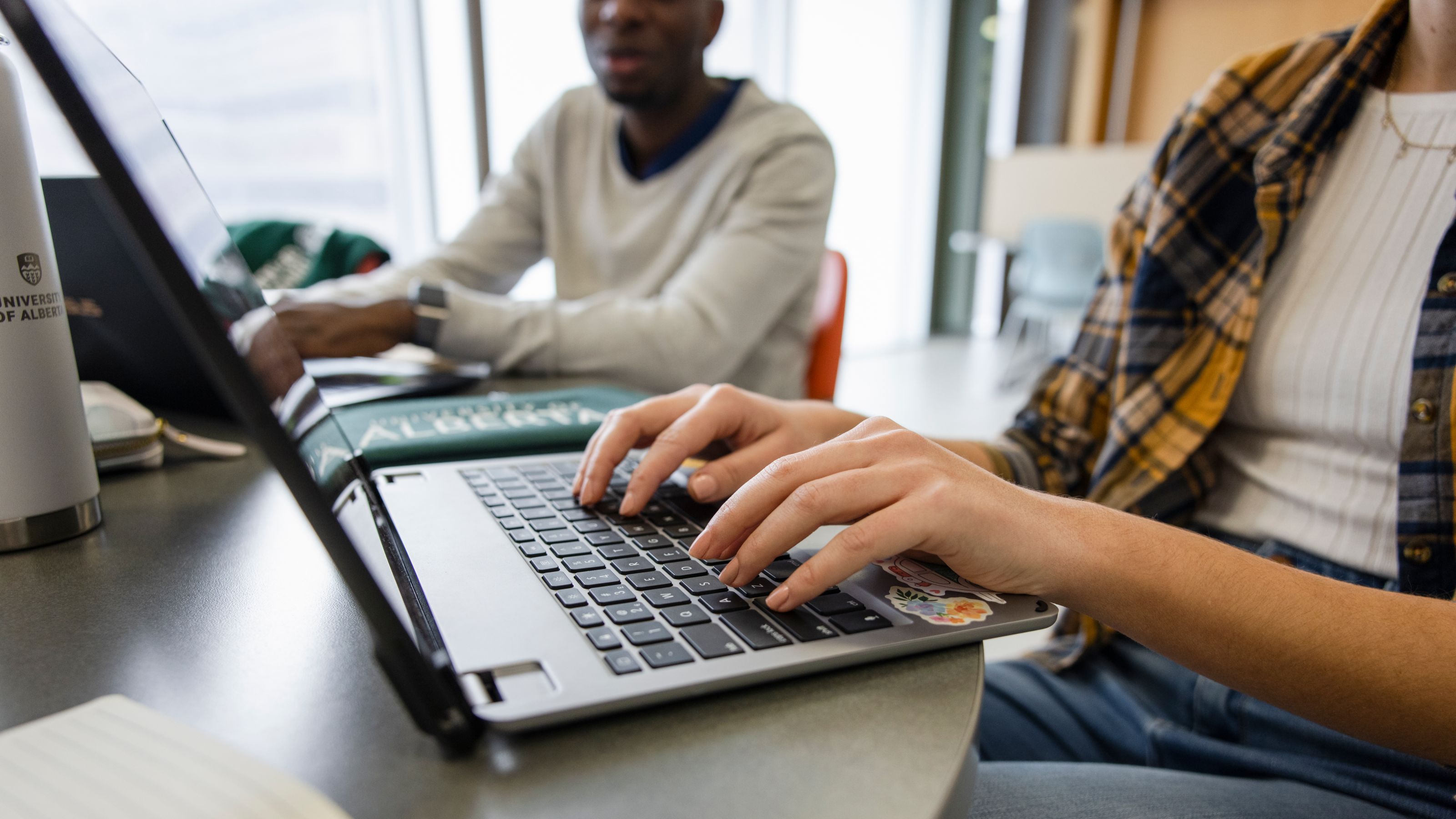 Students using laptop.
