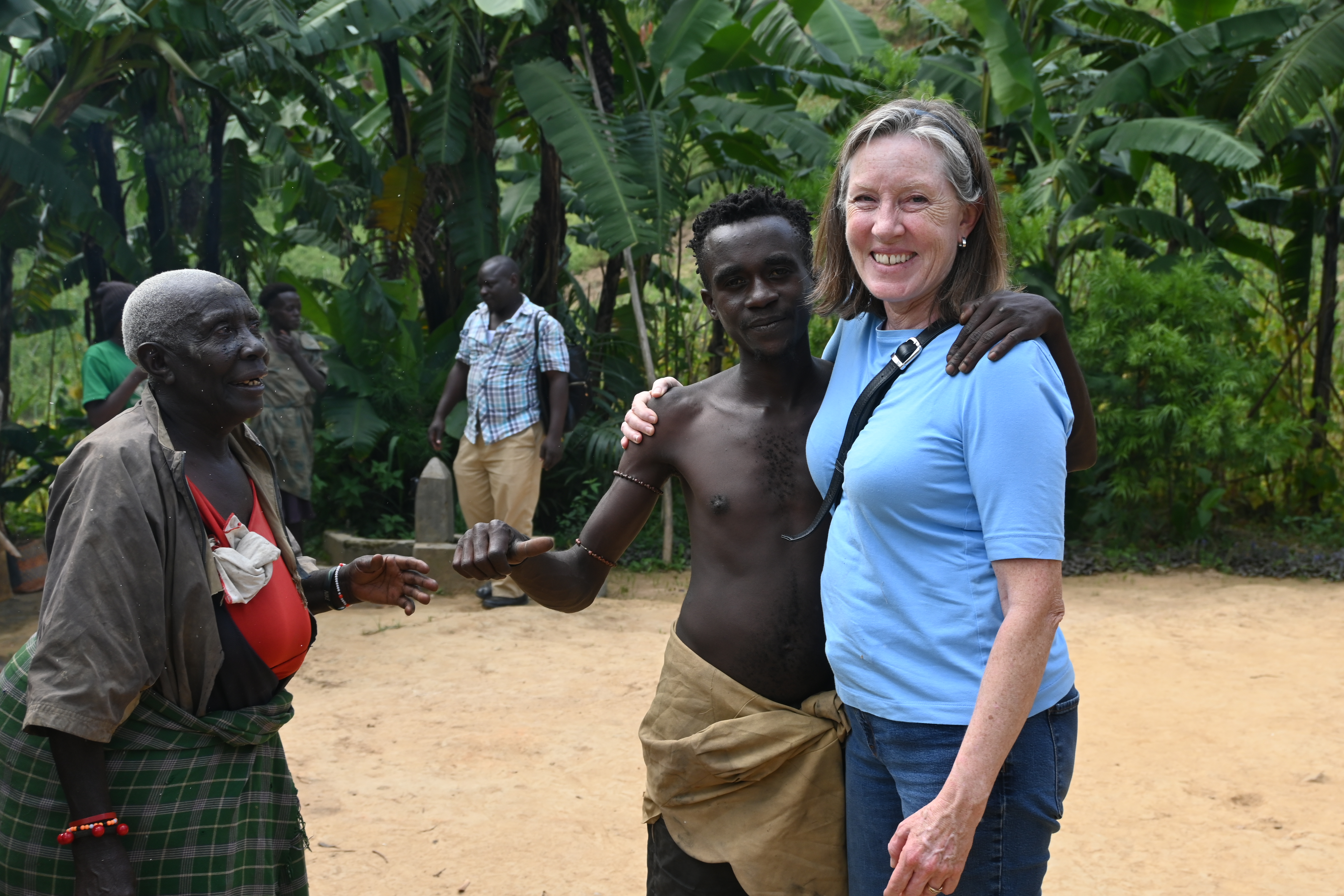 Melanie at a Batwa village near Kisoro, Uganda, where she was visiting the community to learn about their traditional folktales for her latest project.
